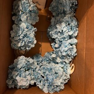 Set of 7 glasses of small center pieces with baby blue flowers.